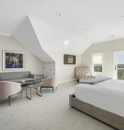 Elegant bedroom at 2B Bumblebee Lane in Hilltop Lodge Residences, featuring luxurious furnishings and scenic views.