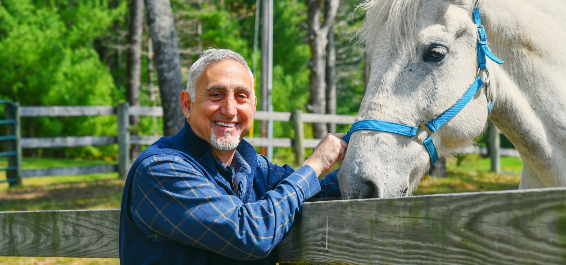 Paul Mihailides with a horse at The Preserve Sporting Club & Resort