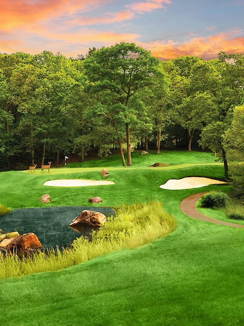 A picturesque golf course with lush greenery, a pond with rocks, and sand traps under a colorful sunset sky.