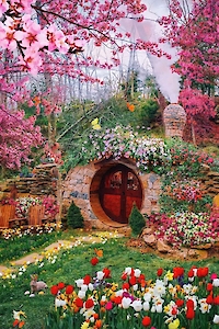 A whimsical garden scene with a round door house, vibrant tulips, flowering trees, and lush greenery creates a magical, storybook charm.