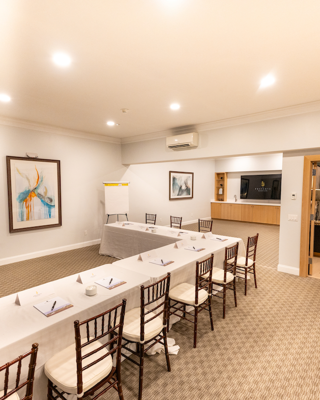 Professional conference room table setup at Hilltop Lodge at Event Venue at The Preserve Resort & Spa in Rhode Island, for meetings and corporate events.